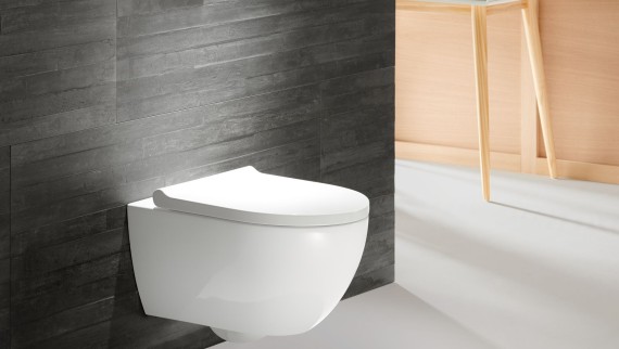 Geberit Acanto WC with actuator plate Sigma70 in red gold