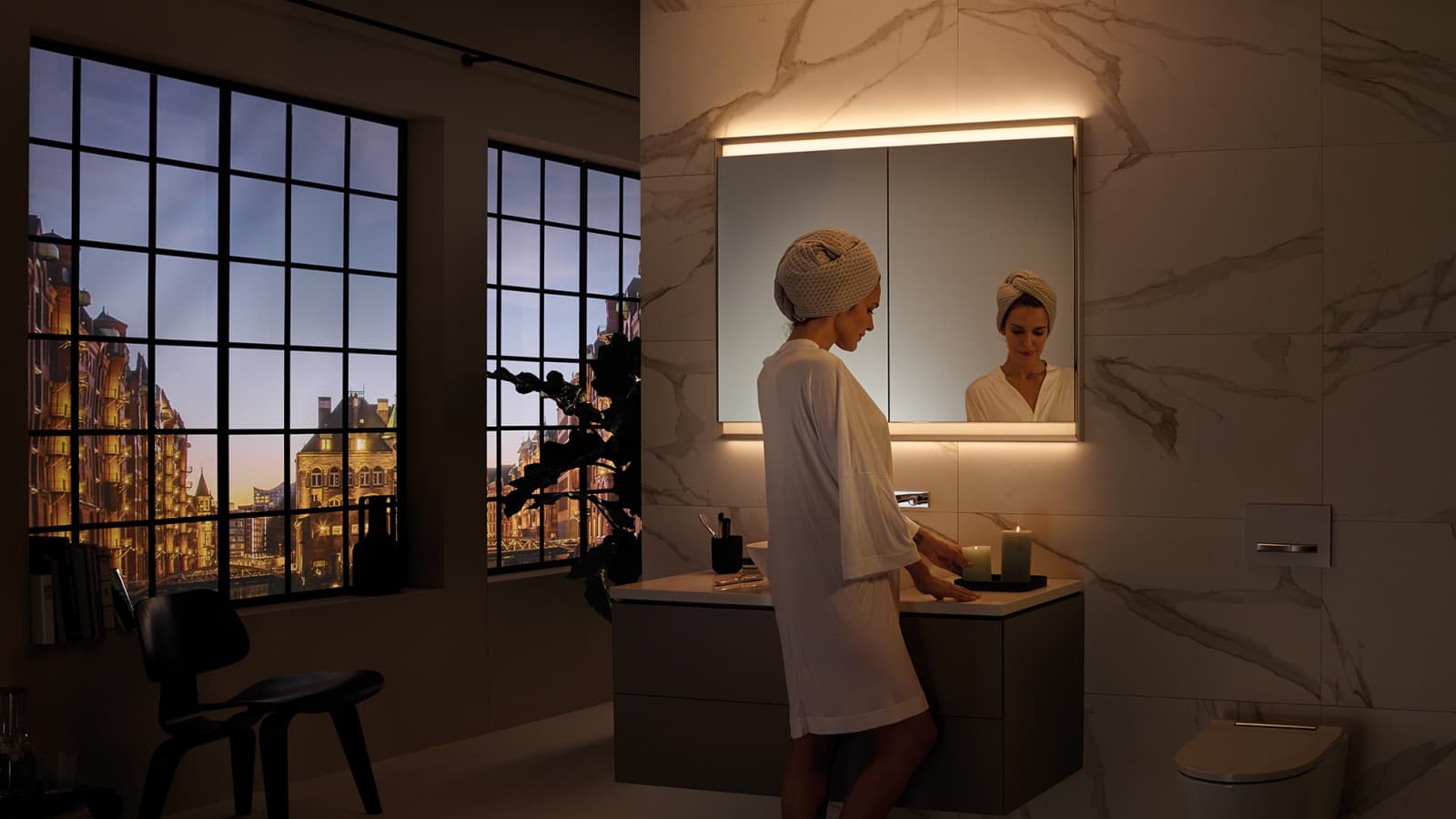 Geberit ONE mirror cabinet with ComfortLight, here with atmospheric candlelight Geberit ONE mirror cabinet with ComfortLight, here with atmospheric candlelight