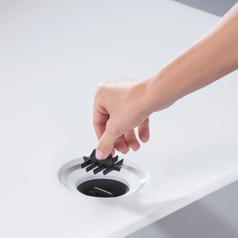 Hair catcher integrated into the drain of the Geberit Setaplano shower surface Hair catcher integrated into the drain of the Geberit Setaplano shower surface