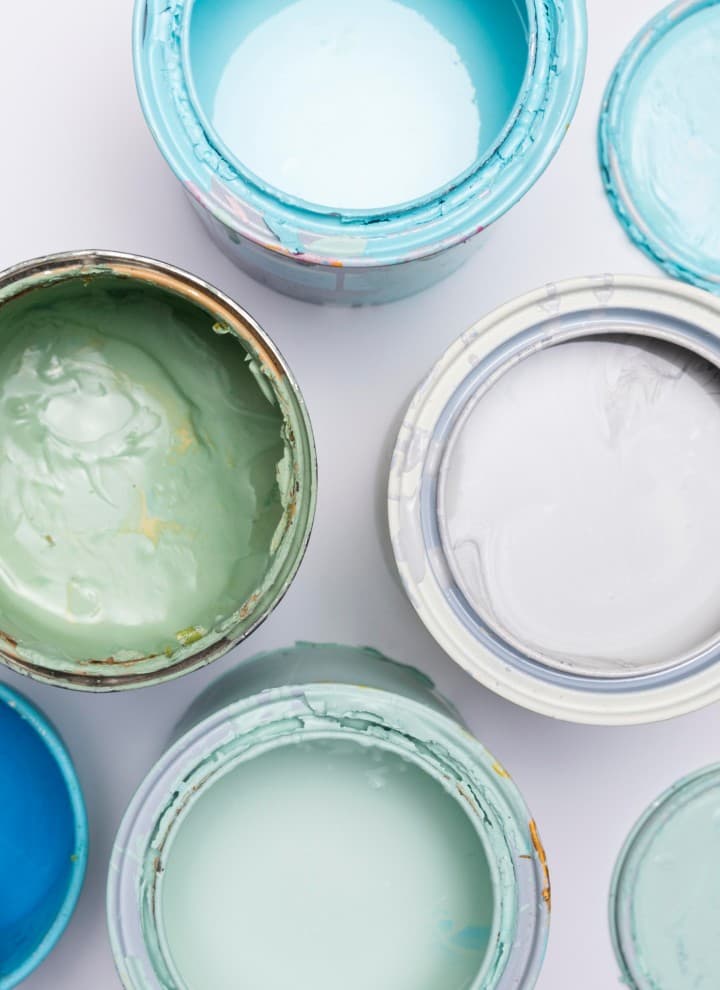 Bird's-eye view of different paint cans. Bird's-eye view of different paint cans.